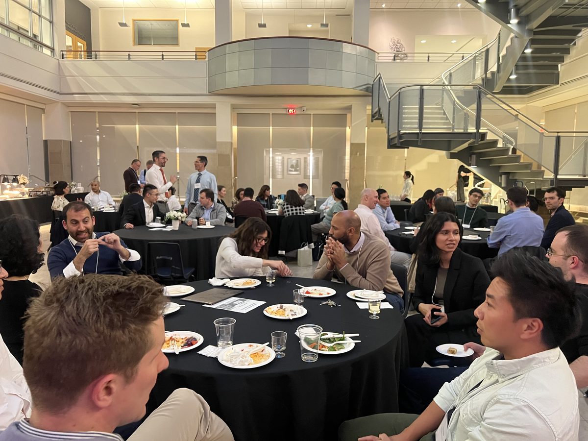 Attendees talking around dinner tables at the 2nd MEM Conference, Rotman School, April 2025